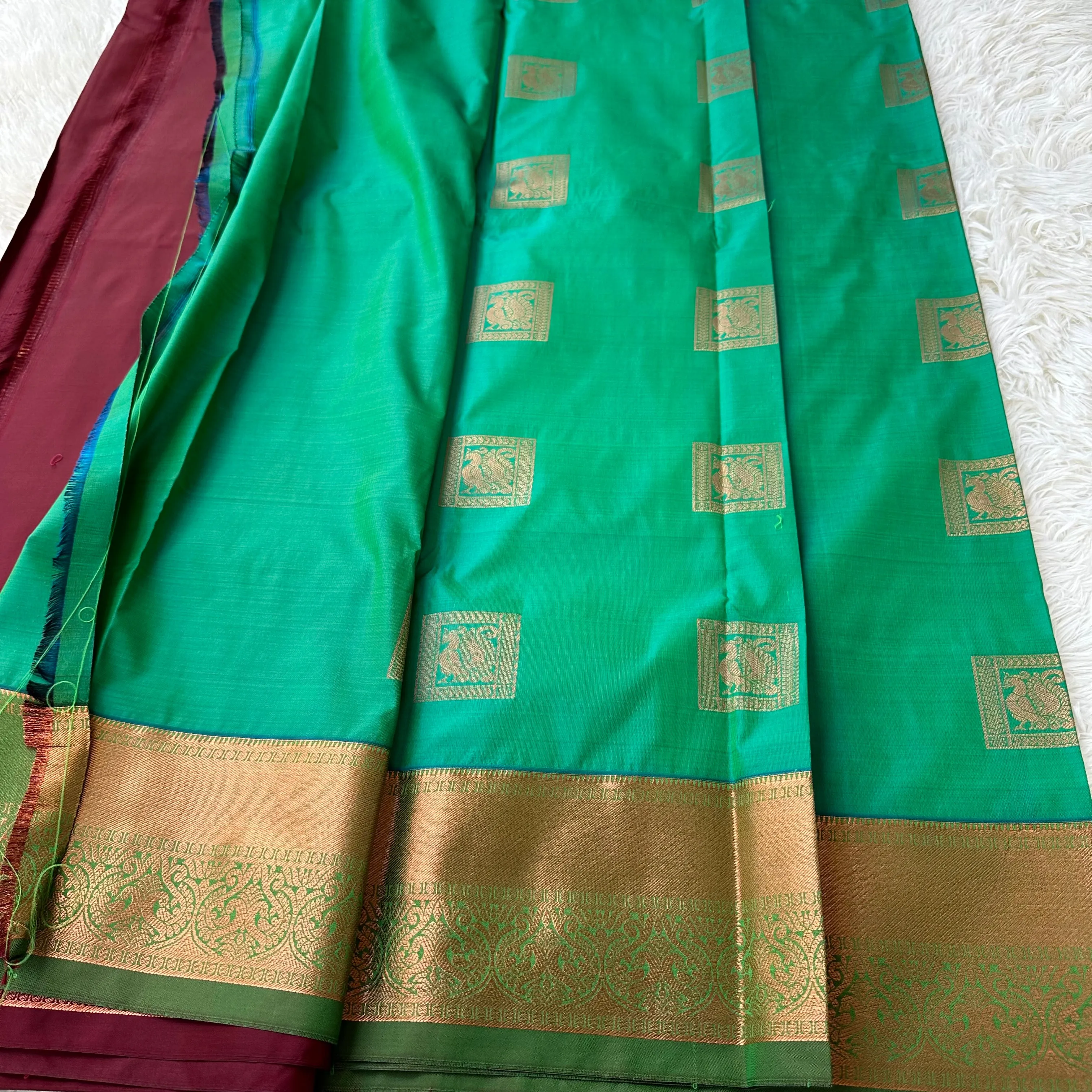 The Harmony Emerald Green Semi Silk Saree  With Meroon Border