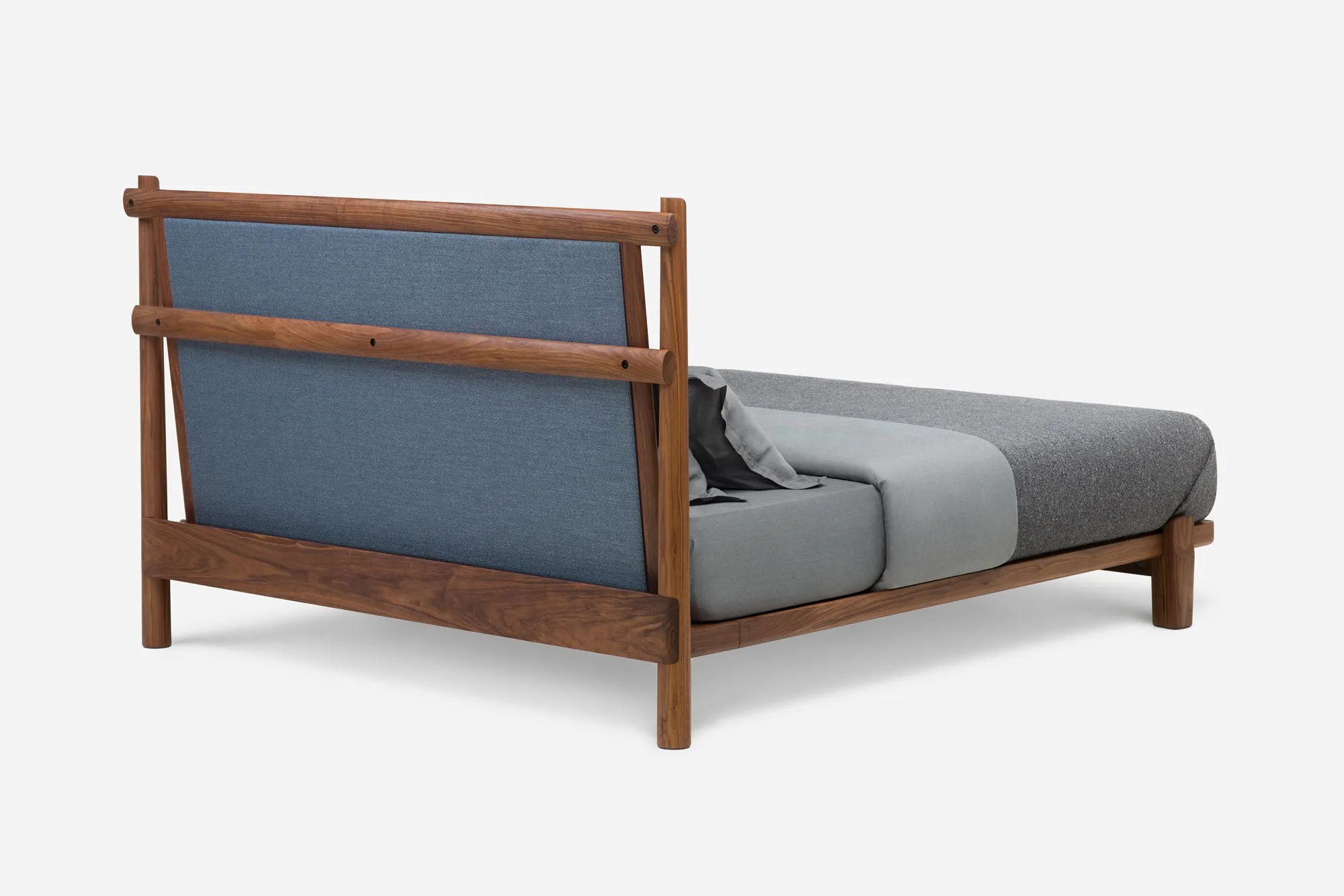 TWENTY-FIVE UPHOLSTERED BED