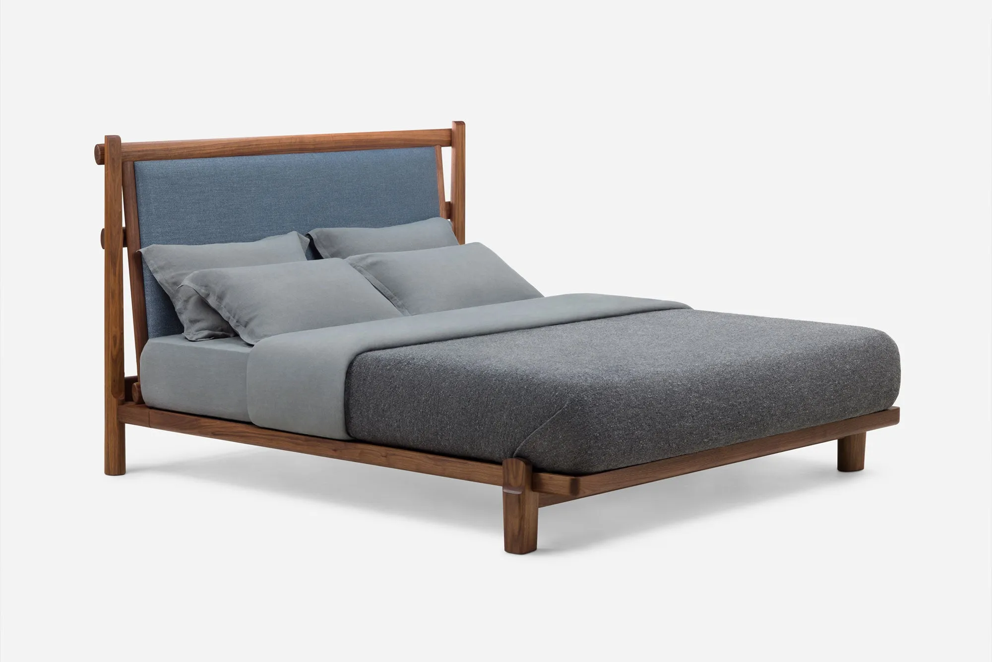 TWENTY-FIVE UPHOLSTERED BED