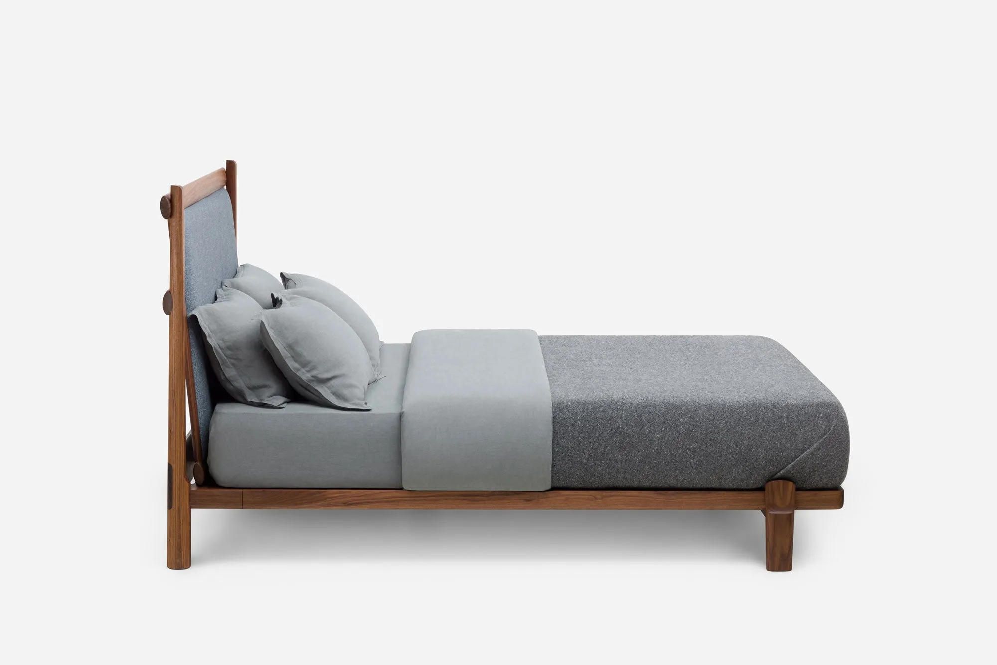 TWENTY-FIVE UPHOLSTERED BED